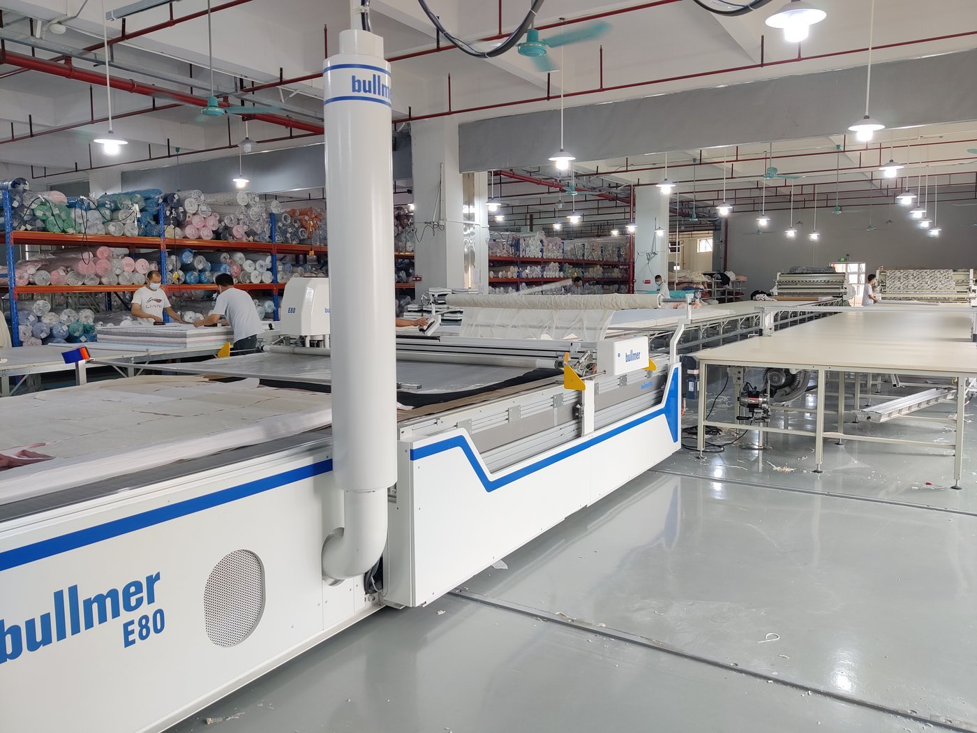 An automatic fabric cutting machine in a factory cutting room