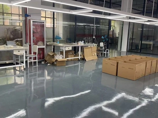 A packing zone with empty cardboard boxes ready for use