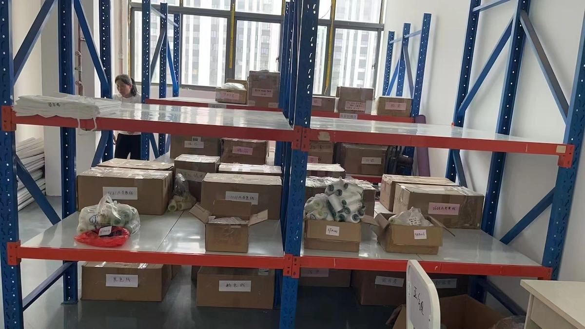 Labelled storage boxes holding trims and thread Labelled storage boxes holding trims and thread