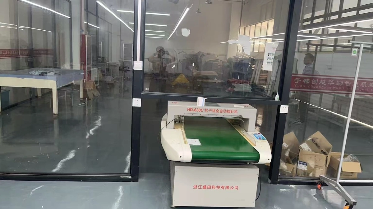 An automatic needle detector machine in a garment factory An automatic needle detector machine in a garment factory