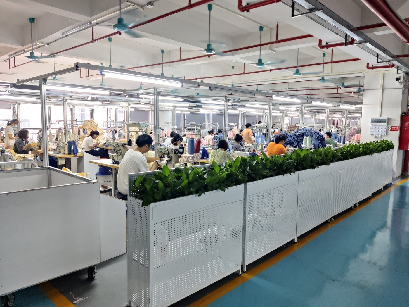 An overview of a garment factory sewing floor An overview of a garment factory sewing floor