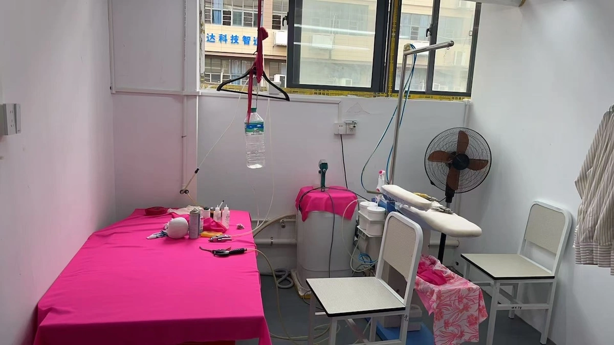 A garment preparation table with sewing tools laid out A garment preparation table with sewing tools laid out