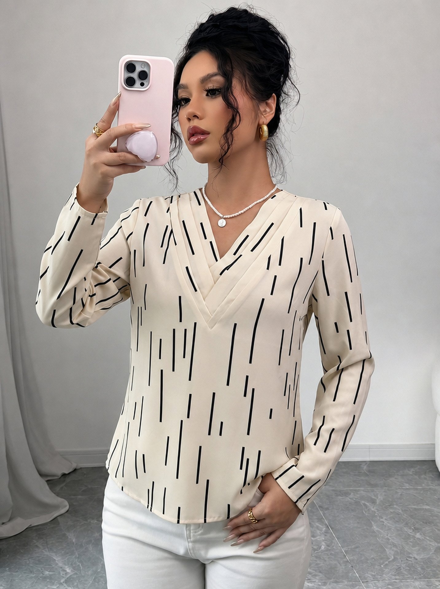 Ivory Abstract-Dash Print V-Neck Long-Sleeve Blouse – Front View Front view of the ivory abstract-dash print v-neck long-sleeve blouse, showing the silhouette and fit.