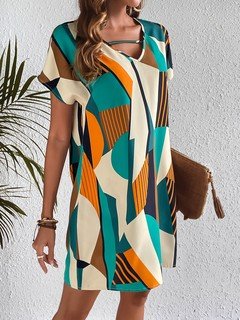 Alternate front view of the teal and yellow geometric v-neck shift dress, showing its silhouette and design details.