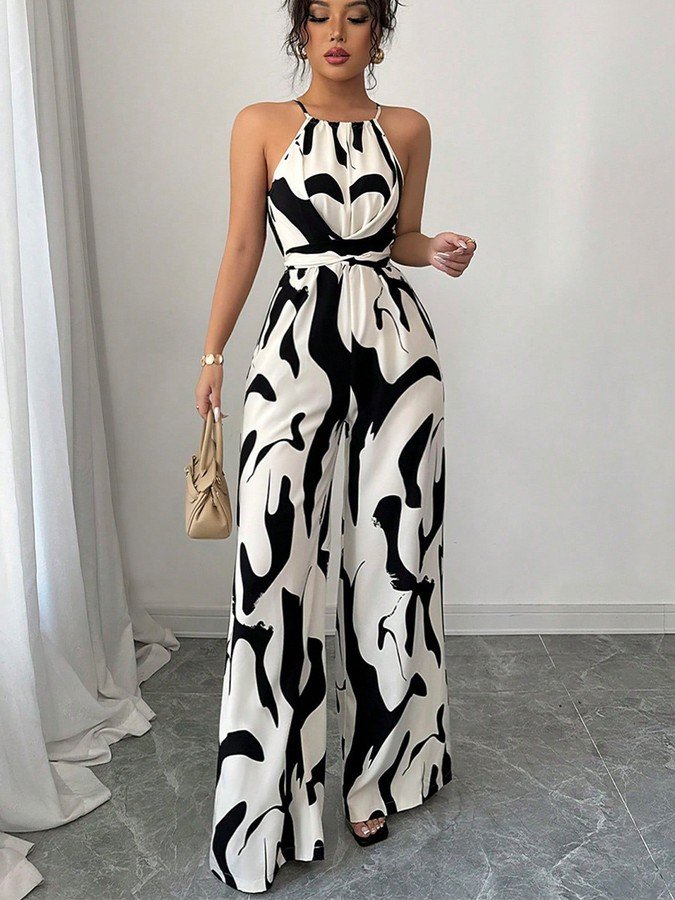 Front view of the black and white abstract halter wide-leg jumpsuit, showing its silhouette and design details.
