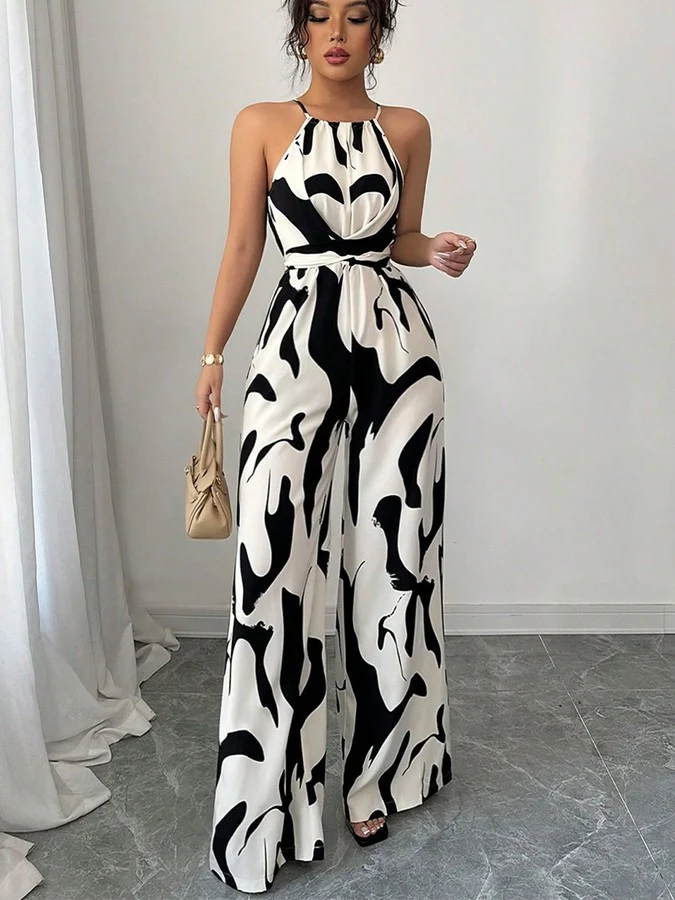Front view of the black and white abstract halter wide-leg jumpsuit, showing its silhouette and design details.