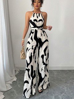 Front view of the black and white abstract halter wide-leg jumpsuit, showing its silhouette and design details.