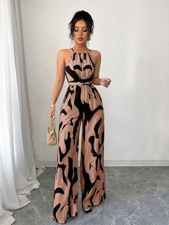 Angled front view of the peach abstract halter wide-leg jumpsuit, showing its silhouette and design details.