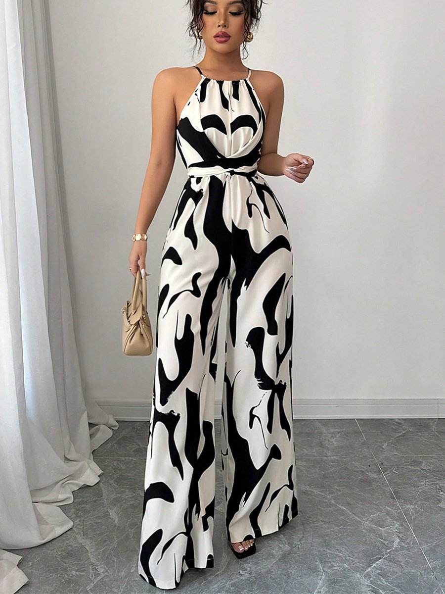 Front view of the black and white abstract halter wide-leg jumpsuit, showing its silhouette and design details.