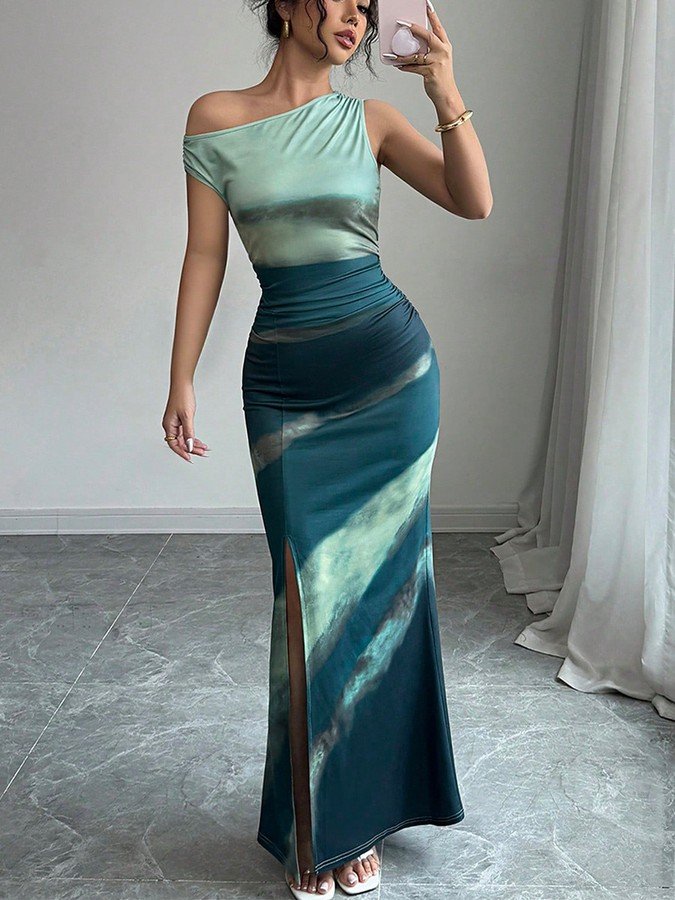 Angled front view of the teal and navy abstract one-shoulder maxi dress, showing its silhouette and design details.