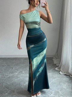 Angled front view of the teal and navy abstract one-shoulder maxi dress, showing its silhouette and design details.