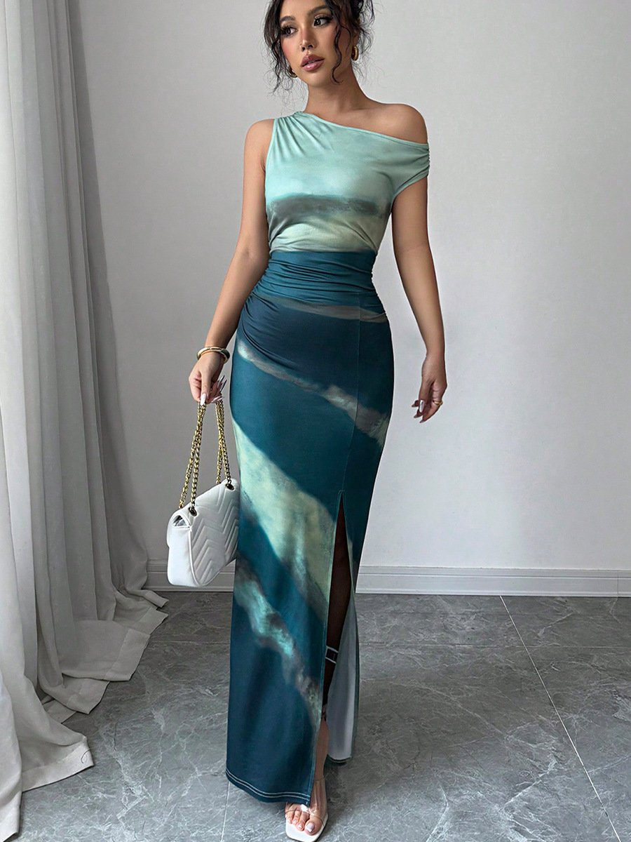 A teal and navy one-shoulder maxi dress styled for a look shot