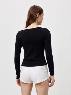 Back view of the black asymmetric boat-neck ruched top, showing its silhouette and design details.