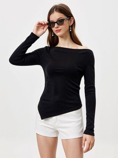 Styled front view of the black asymmetric boat-neck ruched top, showing its silhouette and design details.