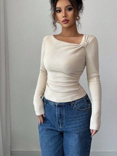 Angled front view of the ivory asymmetric draped-neck top, showing its silhouette and design details.