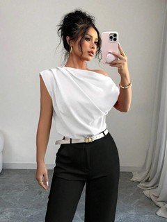 Side view of the white asymmetric one-shoulder draped sleeveless top, showing the silhouette and fit.