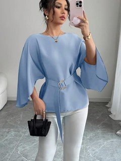 Styled front view of the light blue belted bell-sleeve blouse, showing its silhouette and design details.