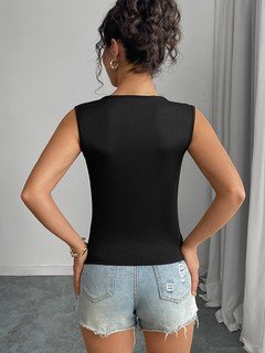 Back view of the black bow-clasp sleeveless top, showing its silhouette and design details.