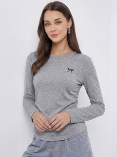 Angled front view of the gray bow-motif long-sleeve ruched top, showing its silhouette and design details.