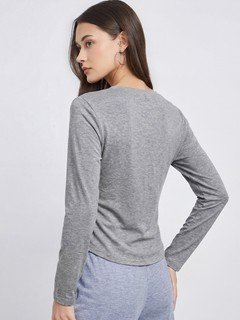 Back view of the gray bow-motif long-sleeve ruched top, showing its silhouette and design details.