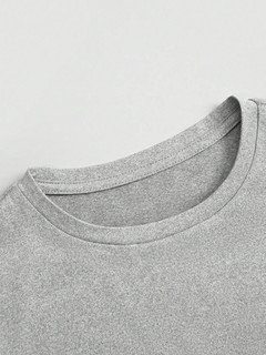 Construction detail of the gray bow-motif long-sleeve ruched top, showing the garment finish.