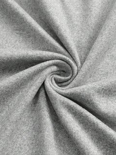 Fabric detail of the gray bow-motif long-sleeve ruched top, showing the surface texture and finish.