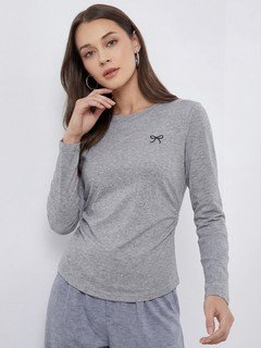 Lifestyle front view of the gray bow-motif long-sleeve ruched top, showing its silhouette and design details.
