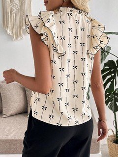 Back view of the cream bow print ruffle-sleeve blouse, showing its silhouette and design details.