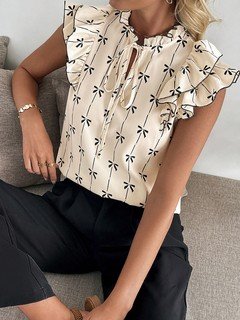 Front view of the cream bow print ruffle-sleeve blouse, showing its silhouette and design details.