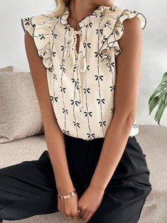 Styled front view of the cream bow print ruffle-sleeve blouse, showing its silhouette and design details.