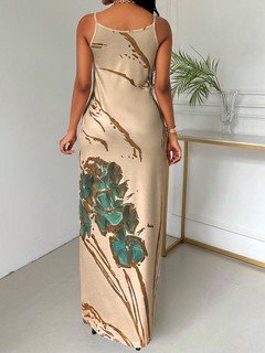 Back view of the beige butterfly print maxi slip dress, showing its silhouette and design details.