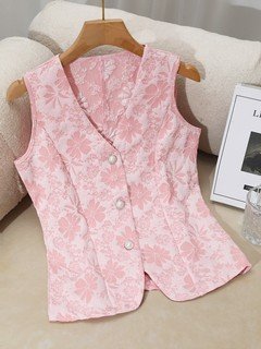 Construction detail of the pink button-front v-neck tailored vest, showing the garment finish.