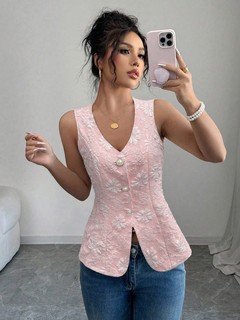 Studio front view of the pink button-front v-neck tailored vest, showing its silhouette and design details.
