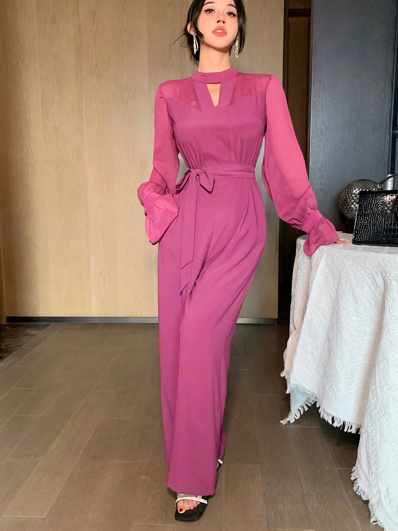 Magenta Cape-Sleeve Tie-Waist Wide-Leg Jumpsuit – Front View Front view of the magenta cape-sleeve tie-waist wide-leg jumpsuit, showing the silhouette and fit.
