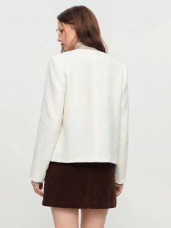 Back view of the ivory collarless textured button jacket, showing its silhouette and design details.