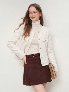 Full-length front view of the ivory collarless textured button jacket, showing its silhouette and design details.