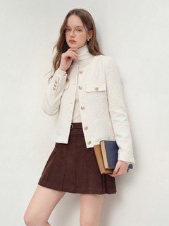 Three-quarter front view of the ivory collarless textured button jacket, showing its silhouette and design details.