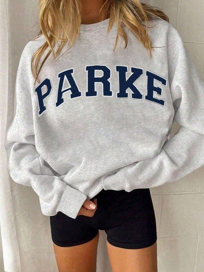 Front view of the gray collegiate oversized sweatshirt, showing its silhouette and design details.