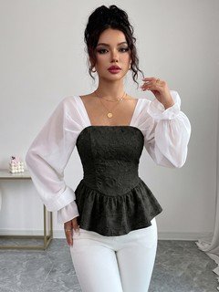 Styled front view of the black contrast mesh puff-sleeve corset peplum top, showing the silhouette and fit.