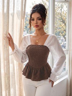 Angled front view of the brown contrast mesh puff-sleeve corset peplum top, showing the silhouette and fit.