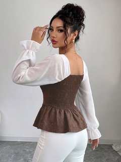 Back view of the brown contrast mesh puff-sleeve corset peplum top, showing the silhouette and fit.