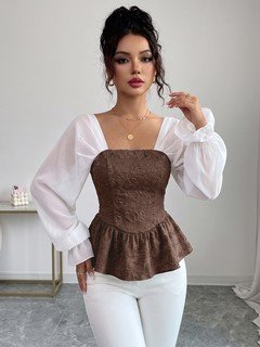 Front view of the brown contrast mesh puff-sleeve corset peplum top, showing the silhouette and fit.