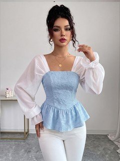 Angled front view of the light blue contrast mesh puff-sleeve corset peplum top, showing the silhouette and fit.