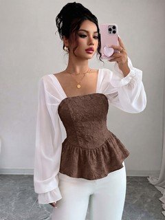 Back view of the light blue contrast mesh puff-sleeve corset peplum top, showing the silhouette and fit.