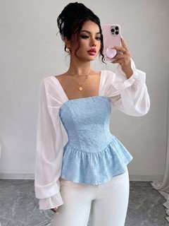 Front view of the light blue contrast mesh puff-sleeve corset peplum top, showing the silhouette and fit.