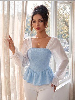 Full length front view of the light blue contrast mesh puff-sleeve corset peplum top, showing the silhouette and fit.