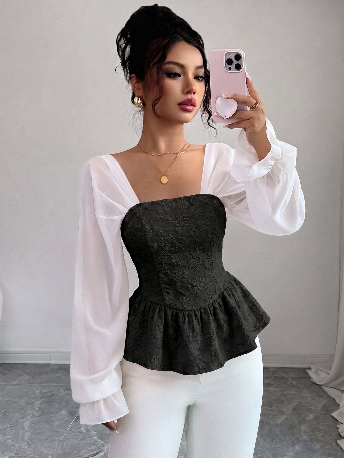 Black Contrast Mesh Puff-Sleeve Corset Peplum Top – Front View Front view of the black contrast mesh puff-sleeve corset peplum top, showing the silhouette and fit.