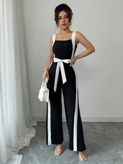 Styled front view of the black and white contrast-trim wide-leg jumpsuit, showing its silhouette and design details.