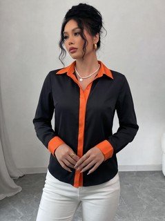 Styled front view of the black contrast-trim long-sleeve button-up shirt, showing the silhouette and fit.