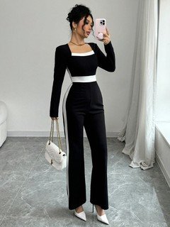 Angled front view of the black contrast-trim square-neck long-sleeve jumpsuit, showing the silhouette and fit.
